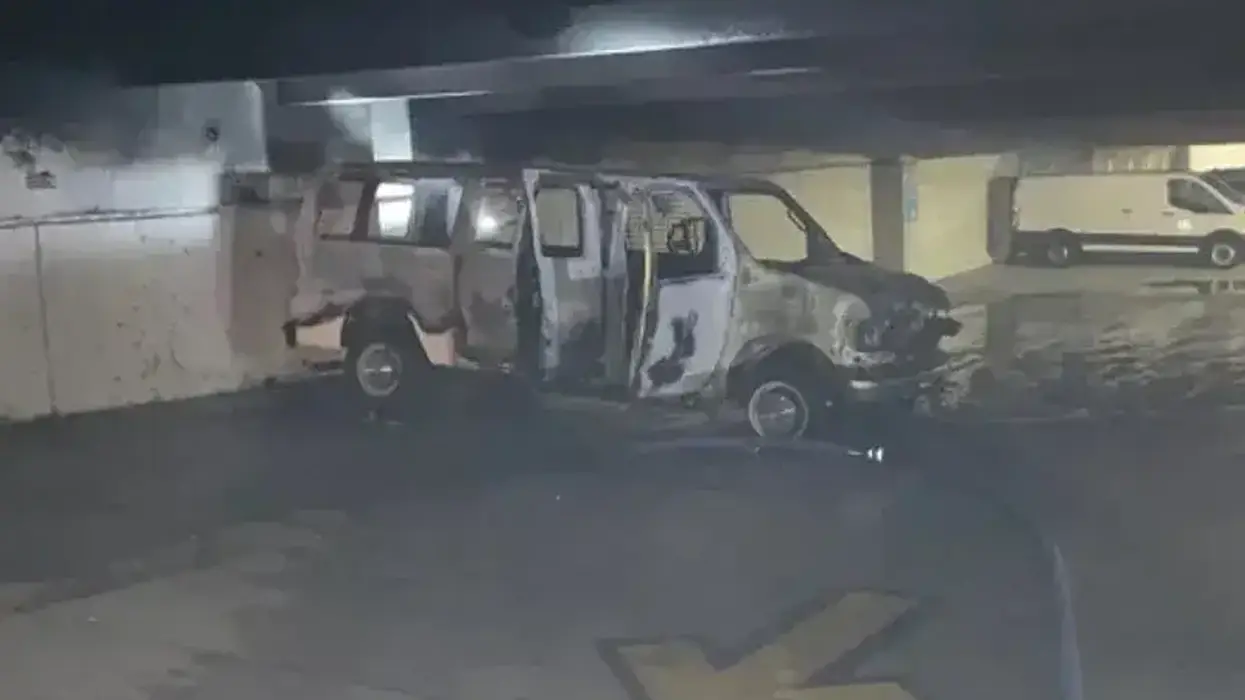 Macomb County work van torched inside parking garage