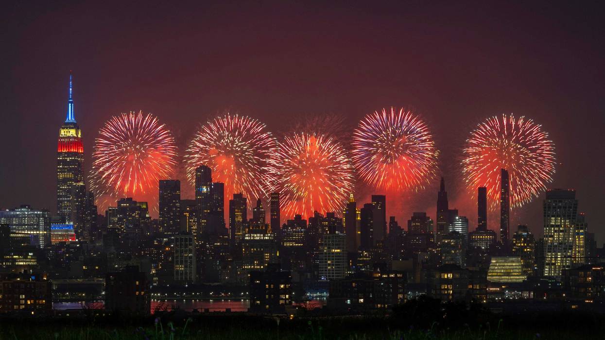 Macy's 4th of July fireworks light up the sky next to the Empire State Building on July 4, 2023