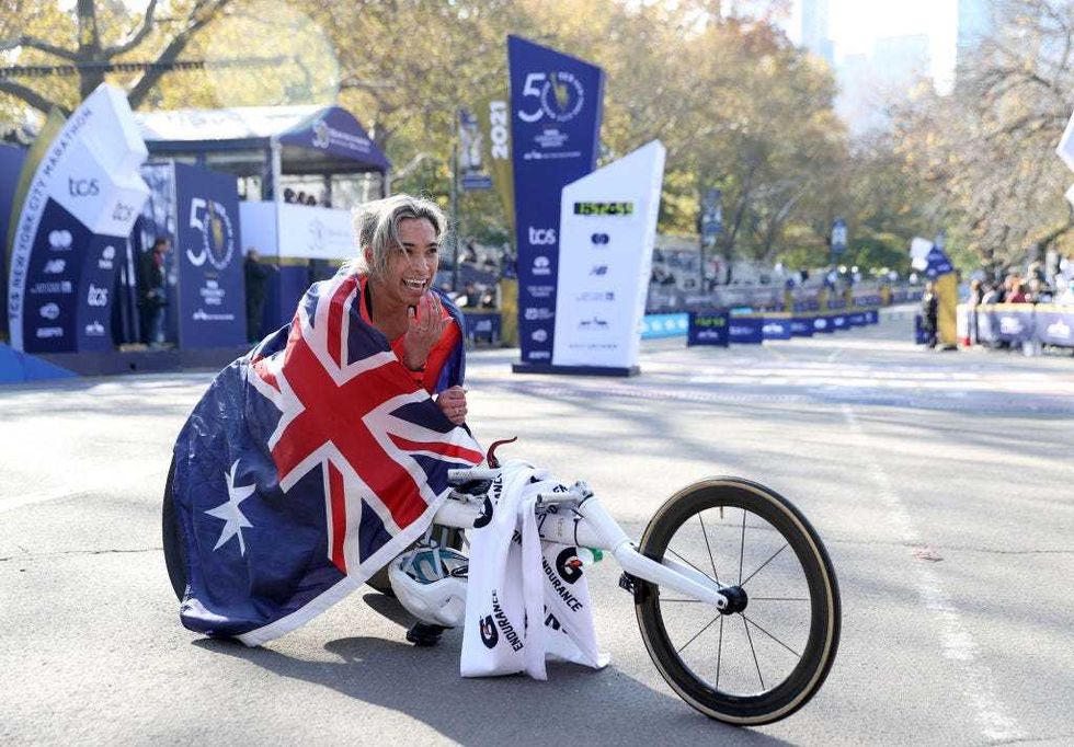 Madison De Rozario of Australia pauses after the finish line after she won the Women