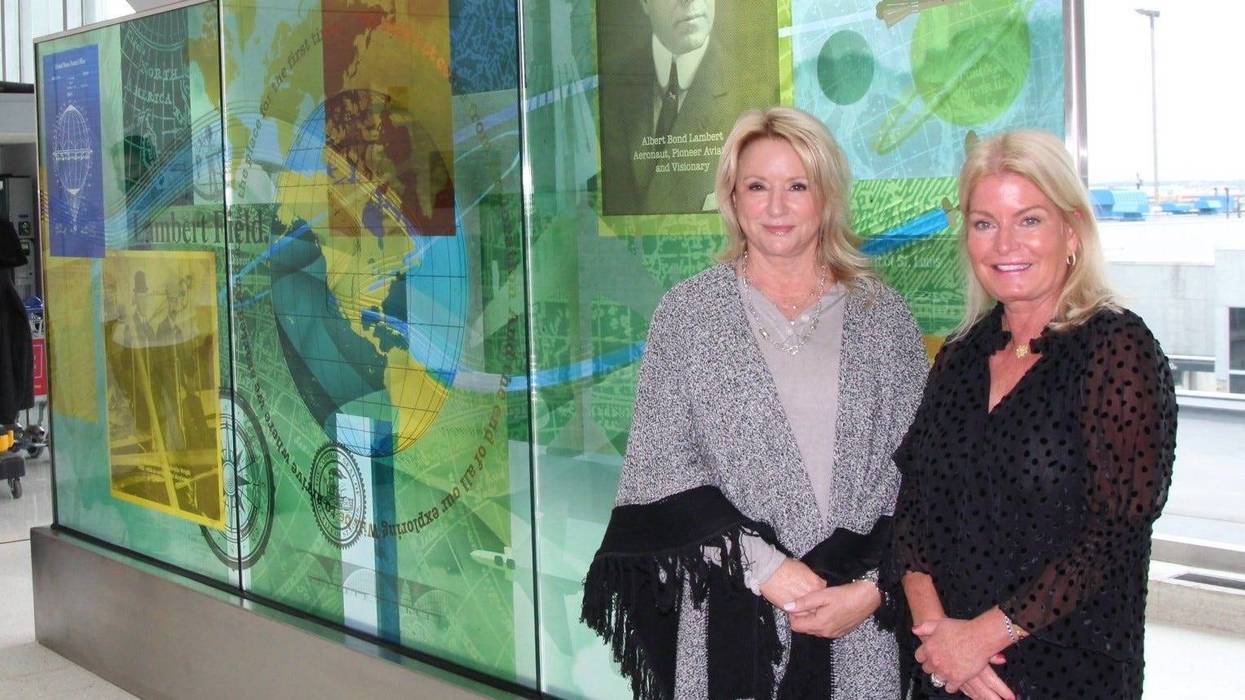 Major Lambert's great-granddaughters Kim Lambert and Lea Bender in front of the mural dedicated to the airport's founder