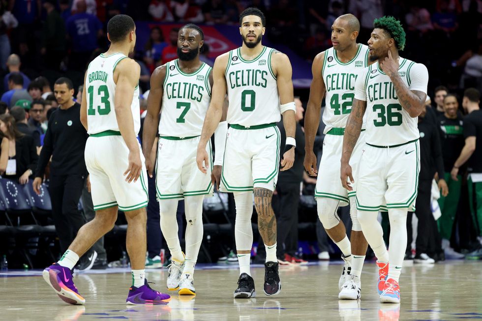 Malcolm Brogdon #13, Jaylen Brown #7, Jayson Tatum #0, Al Horford #42 and Marcus Smart #36 of the Boston Celtics talk against the Philadelphia 76ers during the fourth quarter in game six of the Eastern Conference Semifinals in the 2023 NBA Playoffs at Wells Fargo Center on May 11, 2023 in Philadelphia, Pennsylvania.