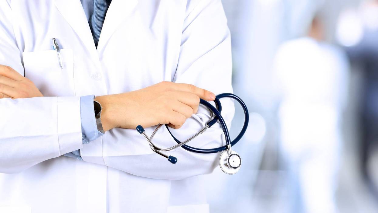 male doctor holding a stethoscope