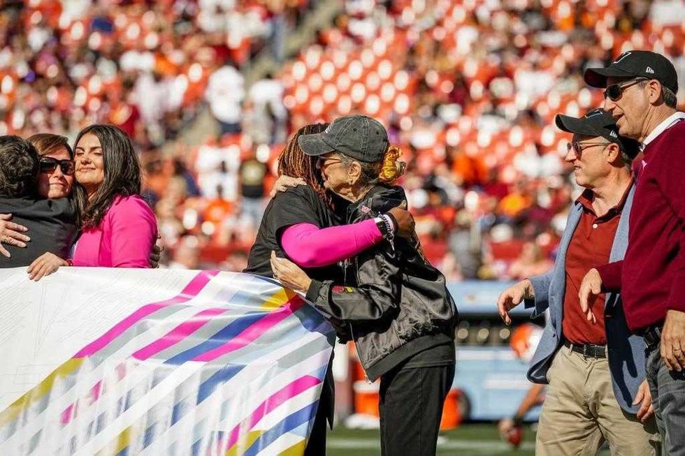 Mama Commander hugs another cancer warrior