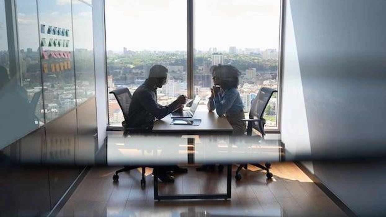Man and woman having meeting in office