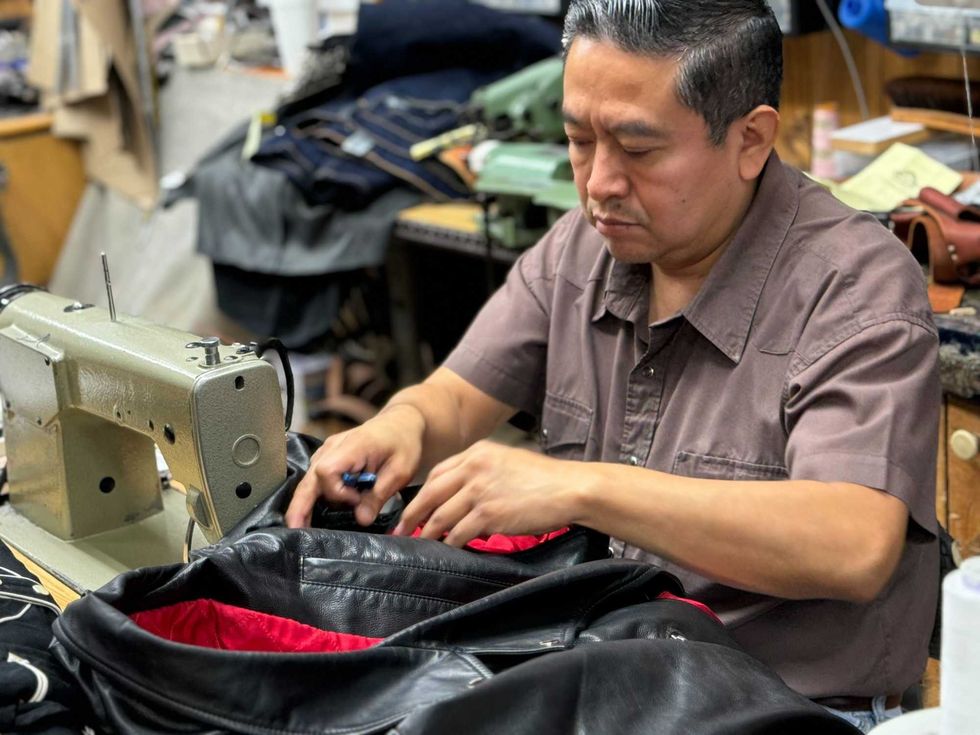 man at sewing machine