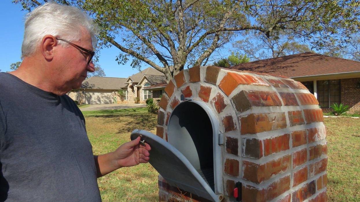 man checking mailbox