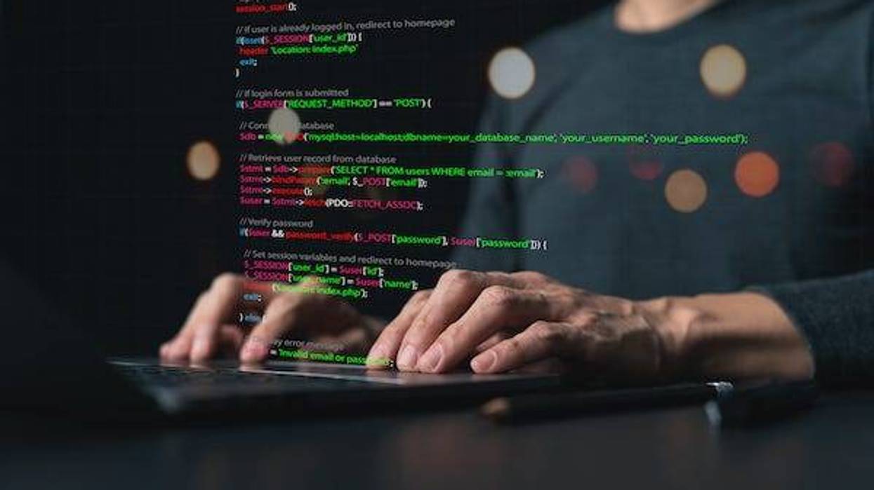 Man coding on a computer concept