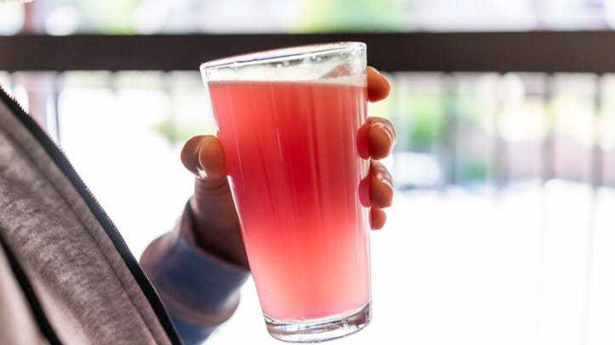 man drinking strawberry tea