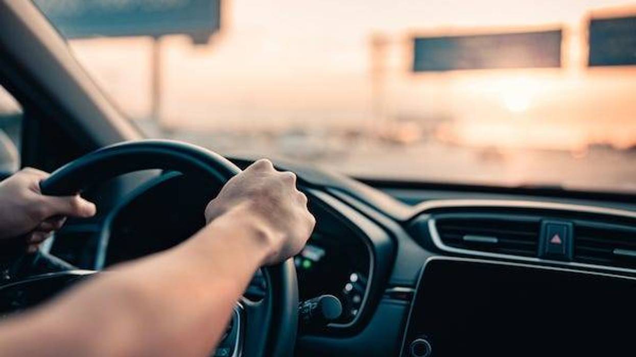 Man driving on highway during sunset