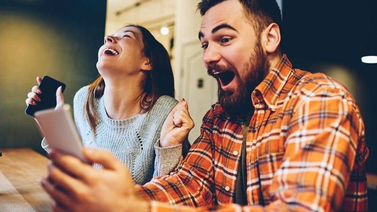 Man getting good news on phone