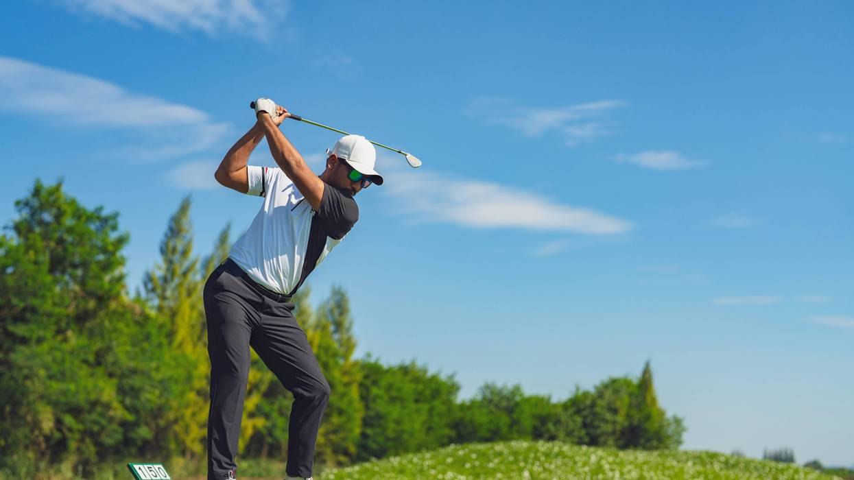 man golfing