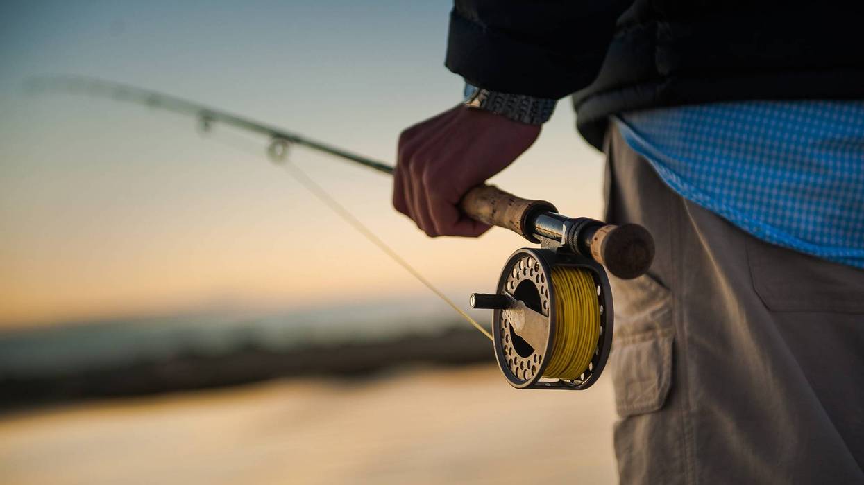 Man holding fly fishing rod