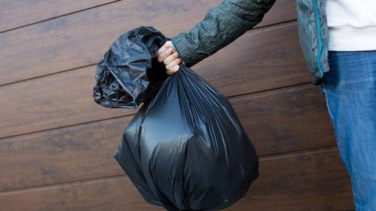 Man holding trash bag
