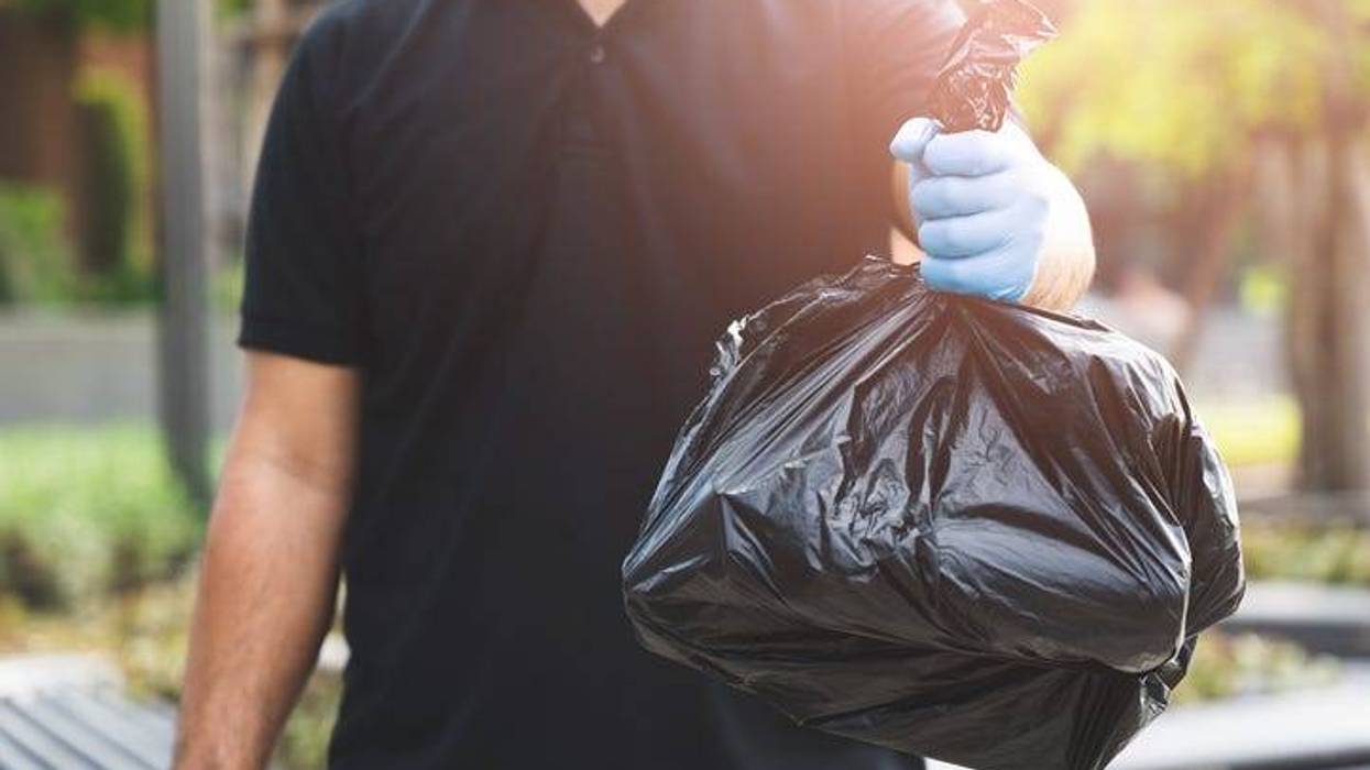 Man holding trash bag