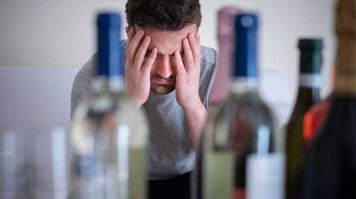 Man hungover after drinking wine
