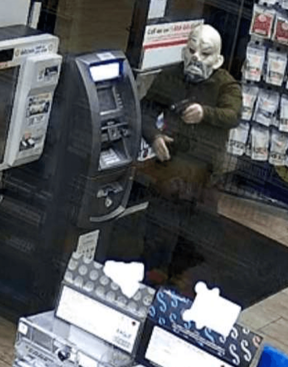 Man in black in clown mask