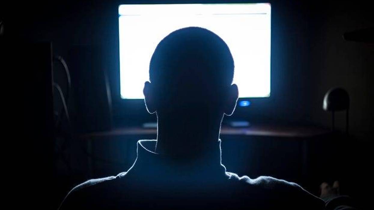 MAn in front of computer