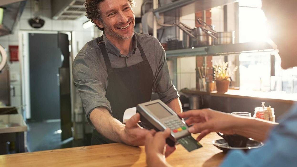 Man paying at a restaurant.
