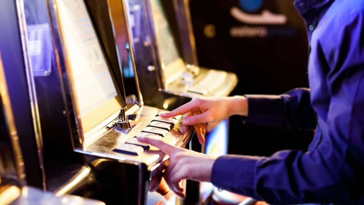 Man playing a slot machine