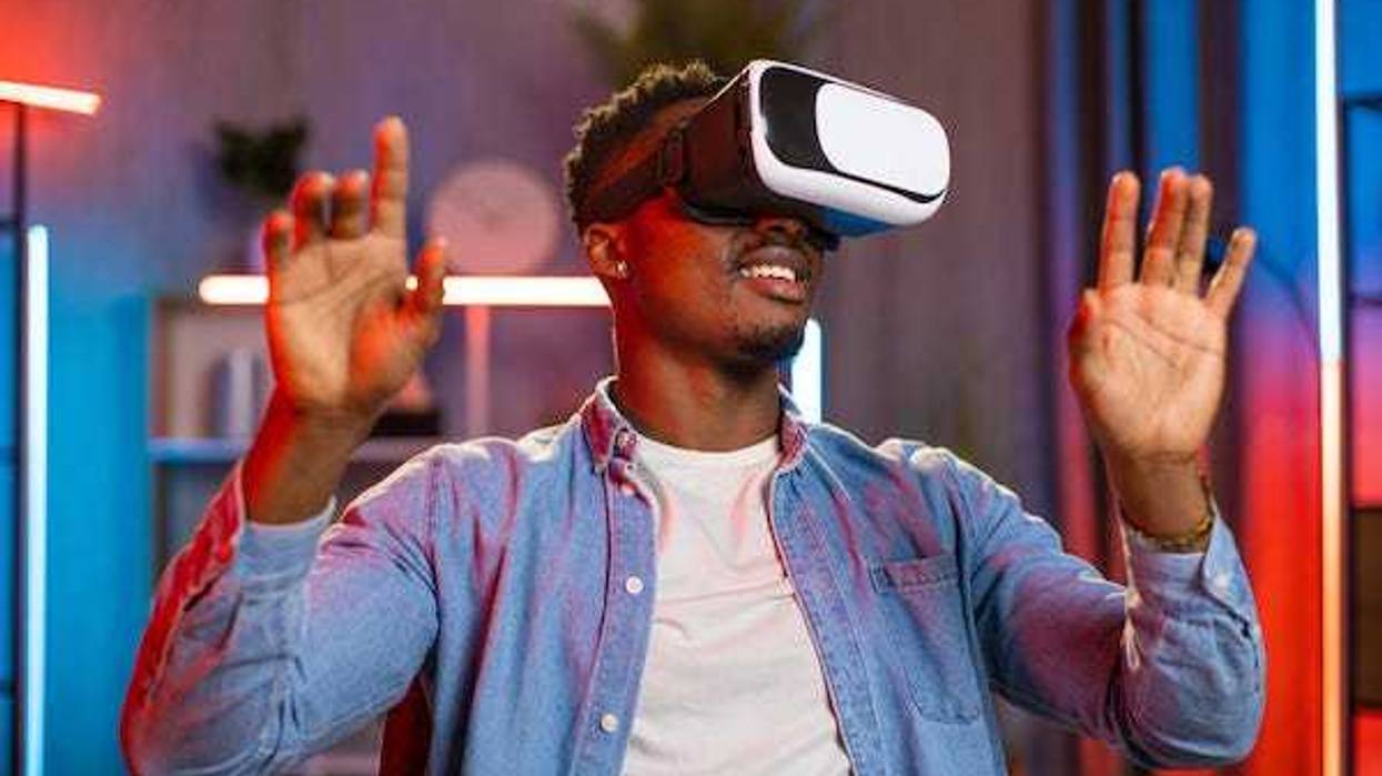 Man playing with VR headset at home