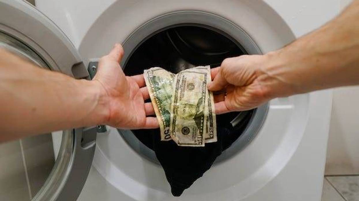 Man pulls money out of washing machine