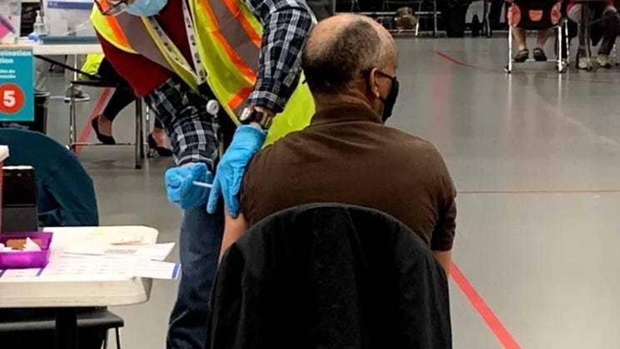 Man receives a vaccine shot in South Richmond