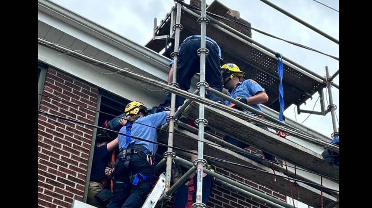 Man rescued from scaffolding after hitting power lines