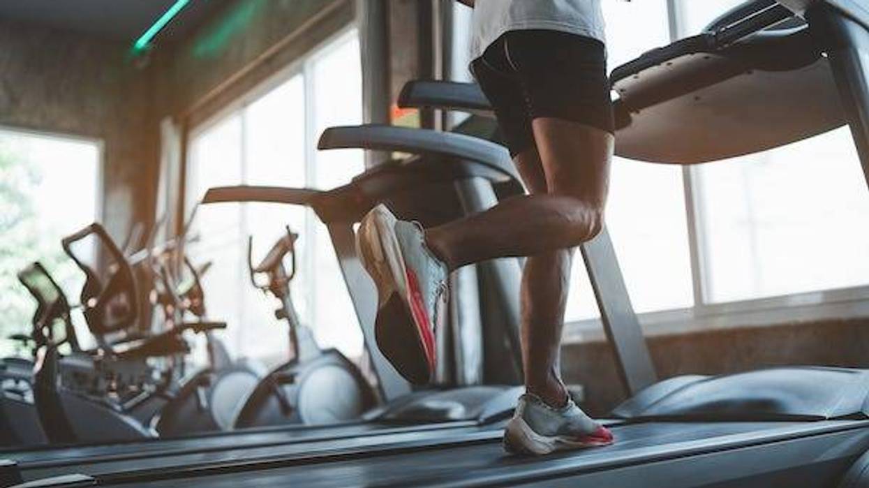 Man running on treadmill in gym
