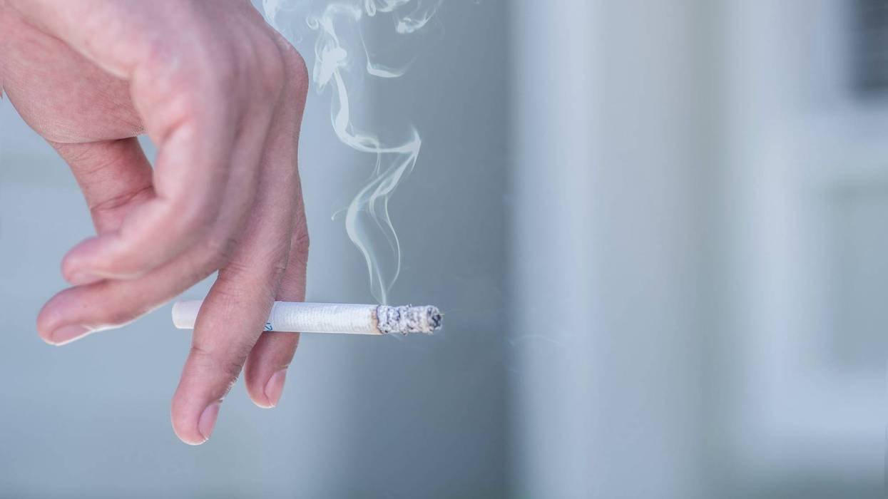 man smoking a cigarette - stock photo