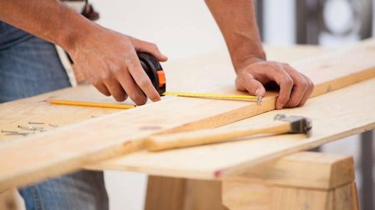 Man using a tape measure