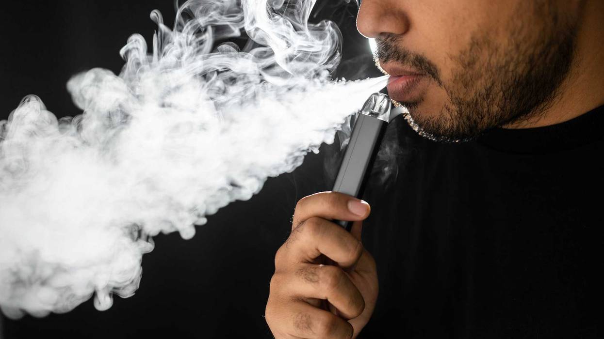 Man using an e-cigarette.