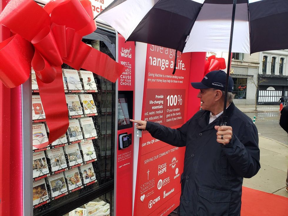 Man using Giving Machine