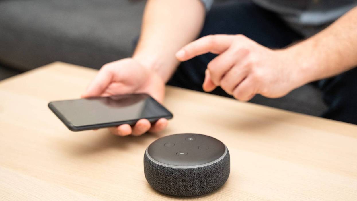 Man using home assistant Bluetooth speaker.