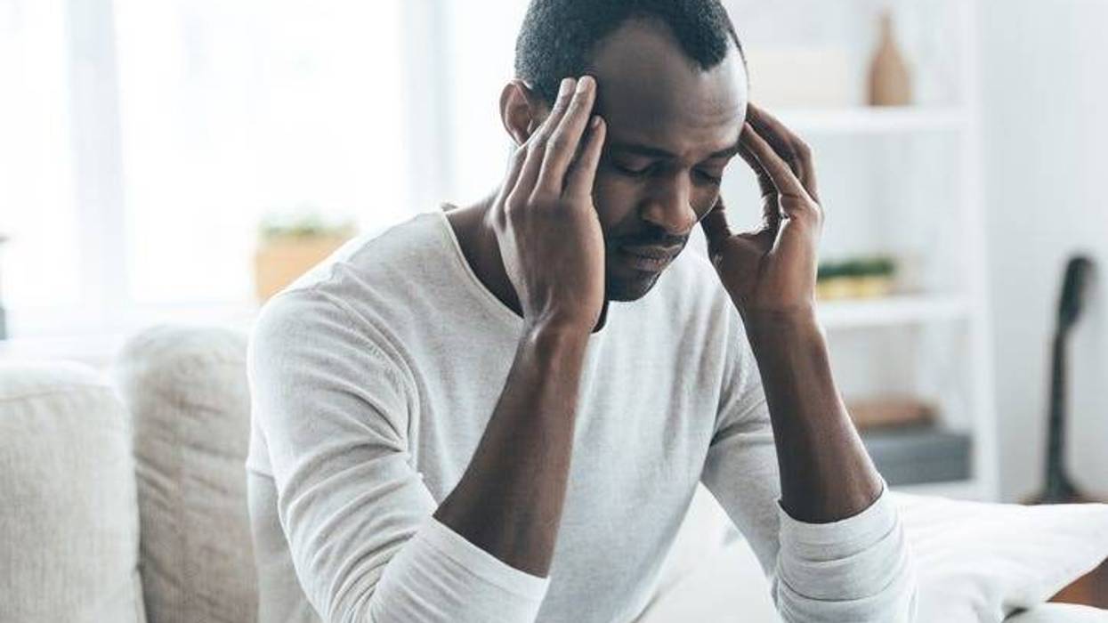 Man with a migraine.