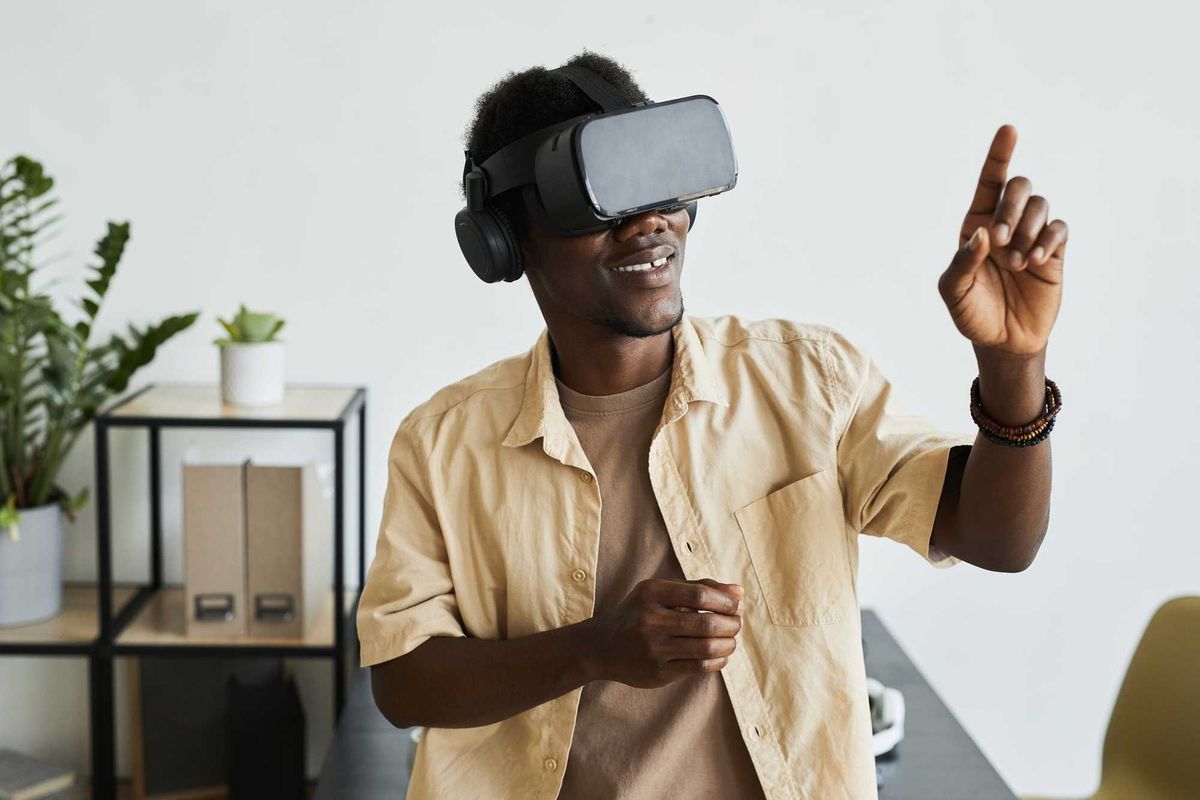 Man with VR glasses on stock photo.