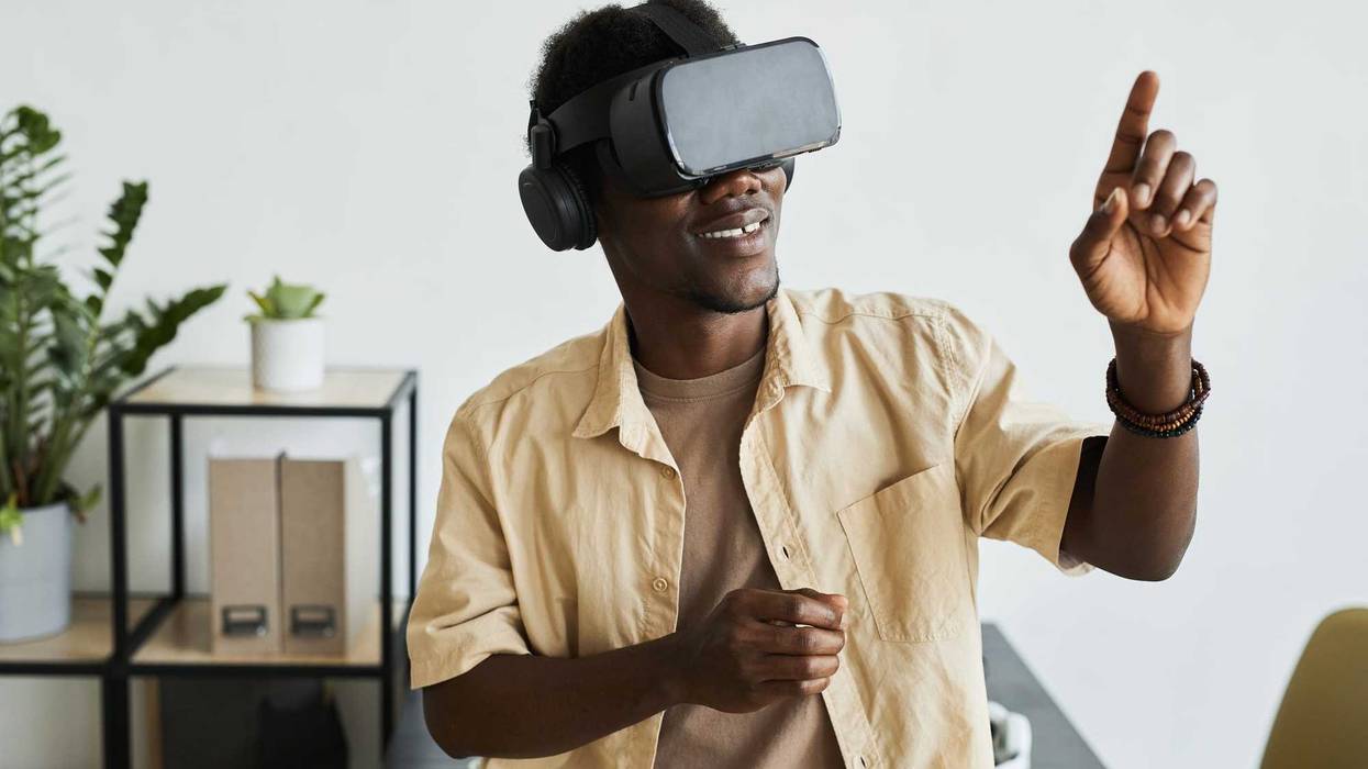 Man with VR glasses on stock photo.