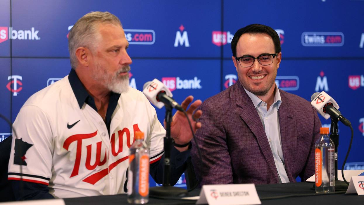 Manager Derek Shelton #8 of the Minnesota Twins addresses media as Vice President and Assistant General Manager Jeremy Zoll looks on during a press conference at Target Field on November 04, 2025 in Minneapolis, Minnesota.