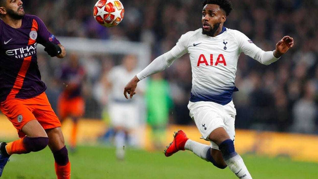 Manchester City's Riyad Mahrez, left, challenges for the ball with Tottenham's Danny Rose during the Champions League, round of 8, first-leg soccer match between Tottenham Hotspur and Manchester City at the Tottenham Hotspur stadium in London, Tuesday, Ap