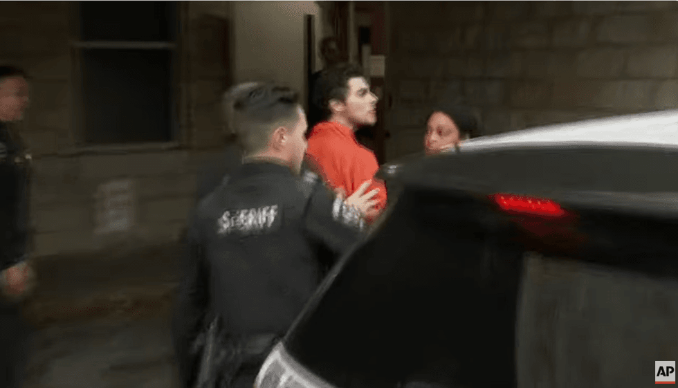 Mangione appeared combative as he was forced into the courthouse