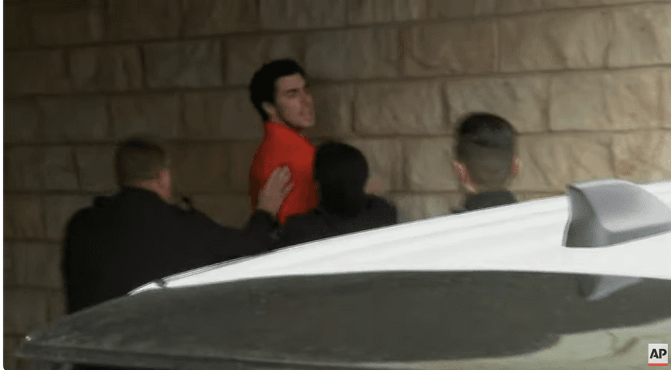 Mangione yelled towards reporters that "this is completely unjust" as police struggled to control him outside the courthouse