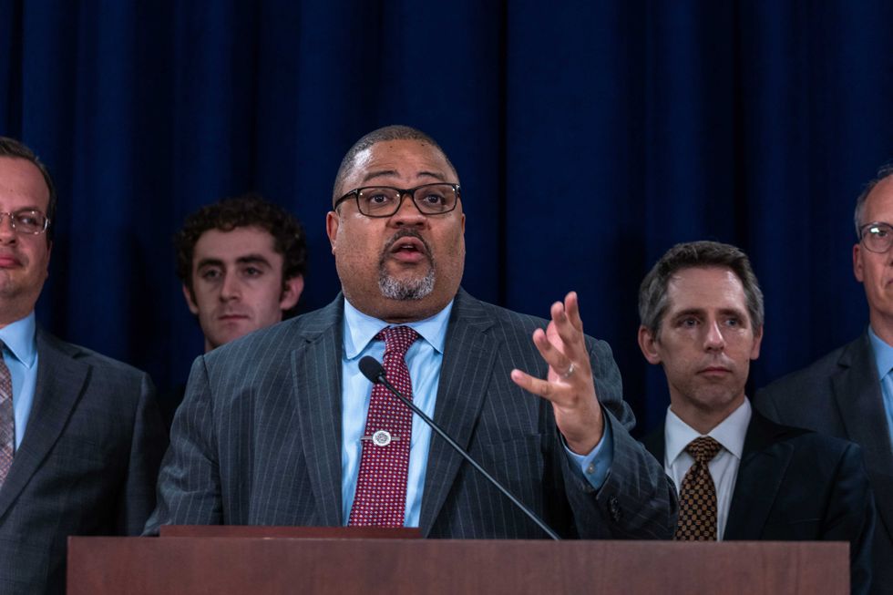 Manhattan District Attorney Alvin Bragg stands with members of his staff at a news conference following the conviction of former President Donald Trump in his hush money trial on May 30, 2024