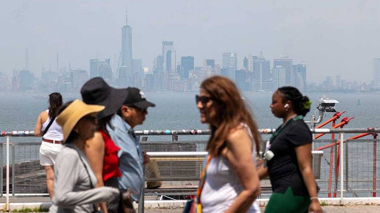 Manhattan is shrouded in an afternoon haze seen from Staten Island on June 23, 2025 in New York City. Temperatures in New York City reached into the high 90's with a heat index of over 100 degrees as the first heat wave of the year moves across parts of the Midwest and East Coast.