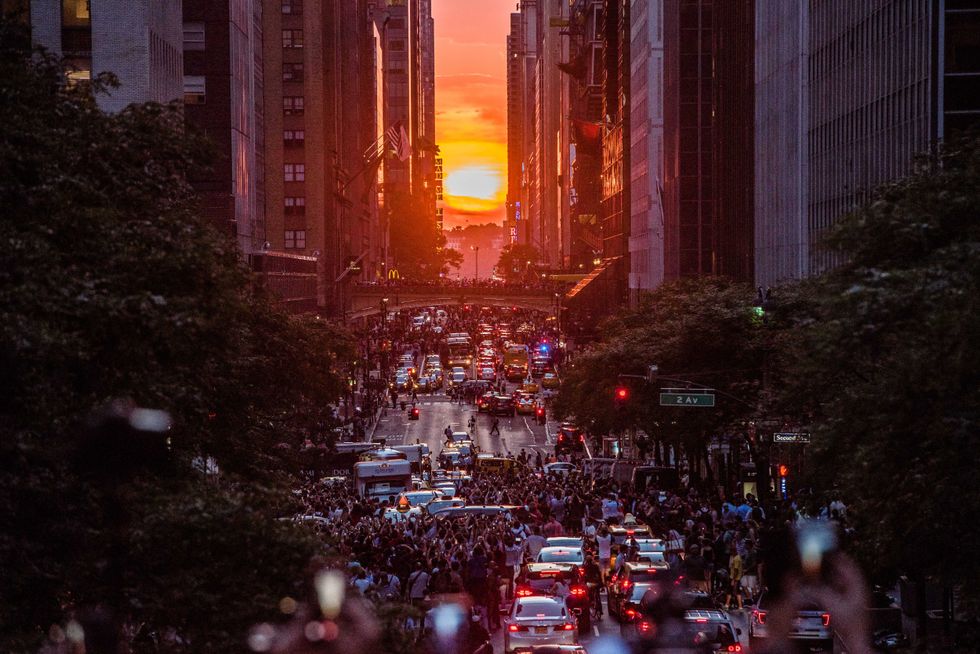 Manhattanhenge viewing celebration high above the streets of New York on July 12, 2018 in New York City.