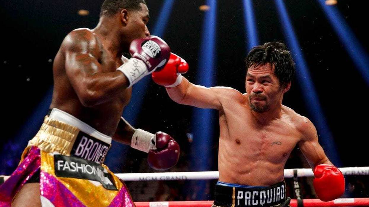 Manny Pacquiao, right, throws a right to Adrien Broner in the WBA welterweight title boxing match Saturday, Jan. 19, 2019, in Las Vegas