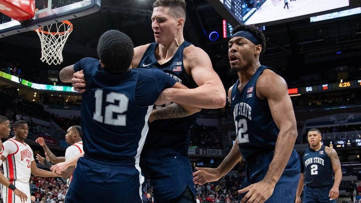 Mar 10, 2022; Indianapolis, IN, USA; Penn State Nittany Lions guard Sam Sessoms (12) and forward John Harrar (21) and guard Jalen Pickett (22) celebrate in the second half against the Ohio State Buckeyes at Gainbridge Fieldhouse.