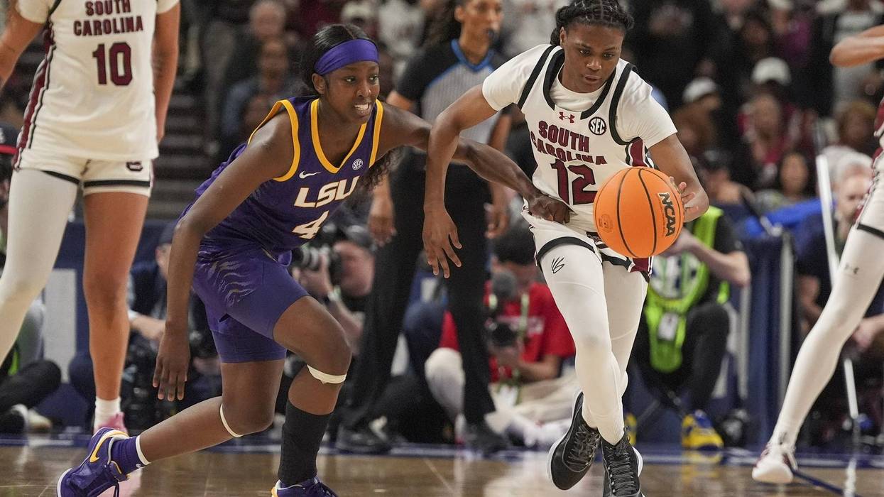 Mar 10, 2024; Greensville, SC, USA; South Carolina Gamecocks guard MiLaysia Fulwiley (12) steals the ball from LSU Lady Tigers guard Flau'jae Johnson (4) during the second half at Bon Secours Wellness Arena.