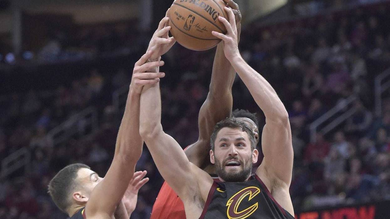 Mar 11, 2019; Cleveland, OH, USA; Cleveland Cavaliers forward Kevin Love (right) rebounds in the second quarter against the Toronto Raptors at Quicken Loans Arena. Mandatory Credit: David Richard-USA TODAY Sports