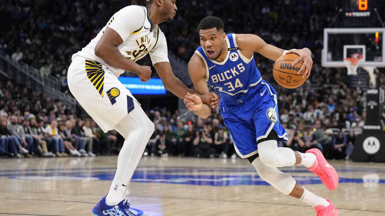 Mar 15, 2025; Milwaukee, Wisconsin, USA; Milwaukee Bucks forward Giannis Antetokounmpo (34) drives for the basket against Indiana Pacers center Myles Turner (33) during the fourth quarter at Fiserv Forum. Mandatory Credit: Jeff Hanisch-Imagn Images