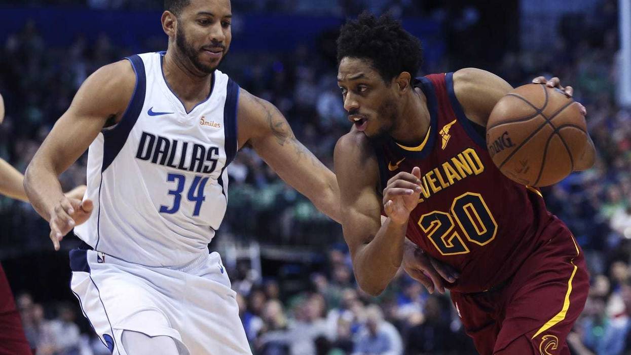 Mar 16, 2019; Dallas, TX, USA; Cleveland Cavaliers guard Brandon Knight (20) drives to the basket as Dallas Mavericks guard Devin Harris (34) defends during the first half at American Airlines Center. Mandatory Credit: Kevin Jairaj-USA TODAY Sports