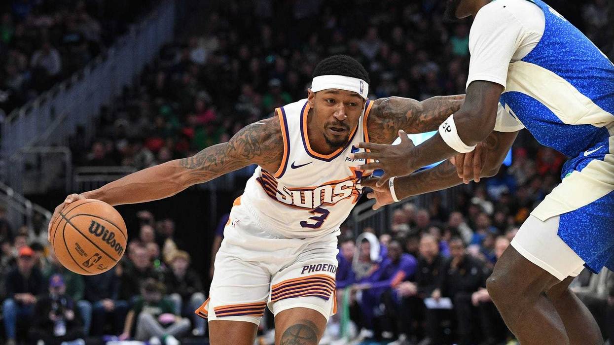 Mar 17, 2024; Milwaukee, Wisconsin, USA; Phoenix Suns guard Bradley Beal (3) drives to the basket against Milwaukee Bucks forward Bobby Portis (9) in the second half at Fiserv Forum. Mandatory Credit: Michael McLoone-Imagn Images